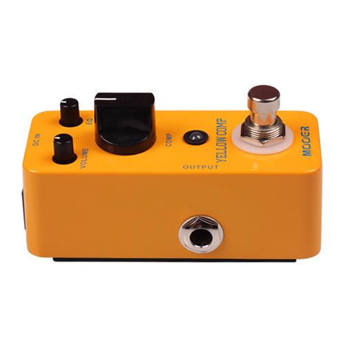 Yellow FX pedal with three black knobs, a footswitch, an output jack on the front, and labeled controls for volume and compression.