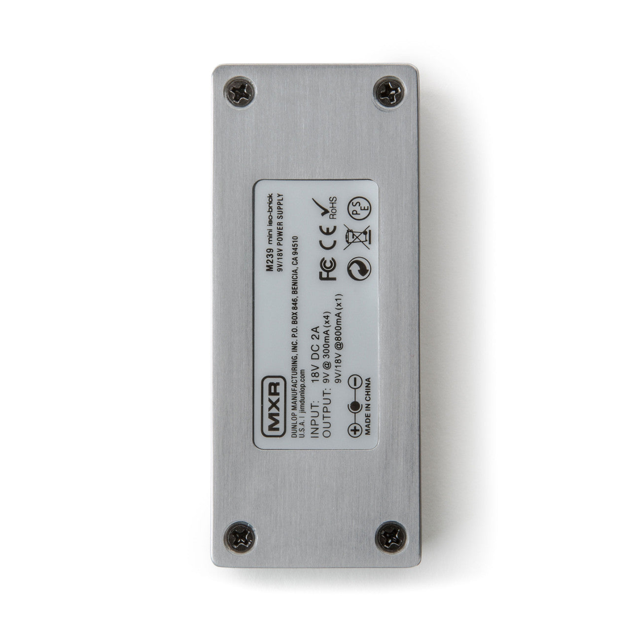 Rectangular silver FX pedal seen from the back, with four screws and a label showing MXR branding and power input/output specifications.