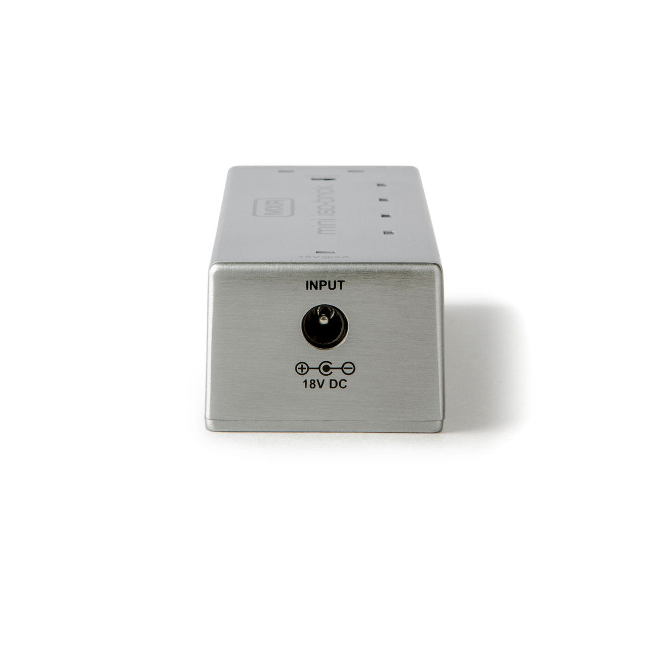 Rectangular silver FX pedal power supply with an 18V DC input jack on one end, labeled "INPUT" above the port.