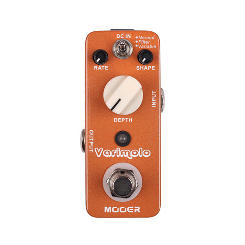 Copper-colored Mooer Varimolo effects pedal with knobs for rate, shape, and depth, toggle switch, input and output jacks, and a footswitch.