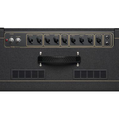 Black amplifier with seven control knobs, power and standby switches, input jack, vent grills, and a central carrying handle on the upper front panel.