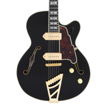Black electric guitar with gold hardware, two cream pickups, tortoiseshell pickguard, F-holes, and a distinctive angular gold tailpiece.
