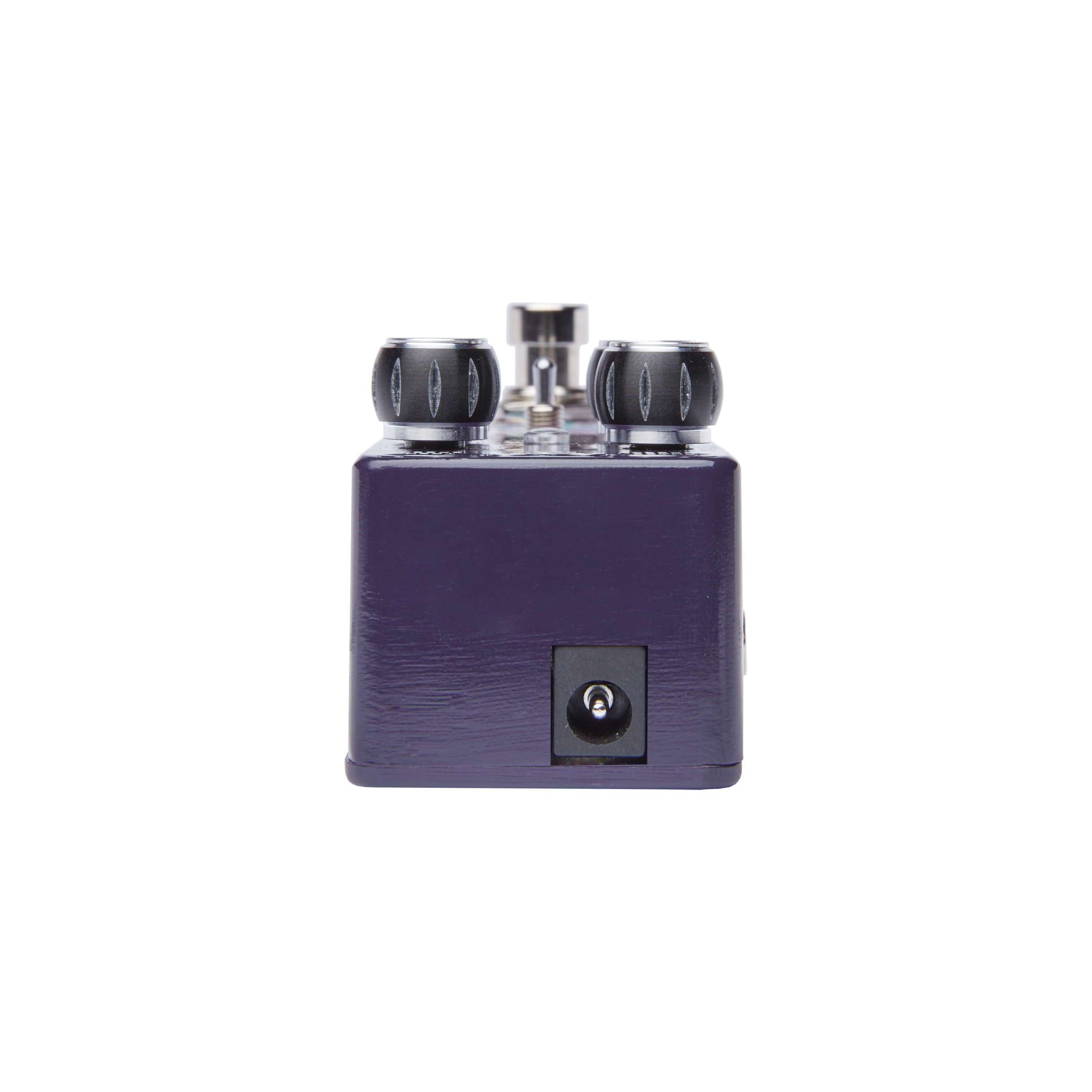 Purple FX pedal viewed from the front, showing a black power input jack and two black top-mounted control knobs.