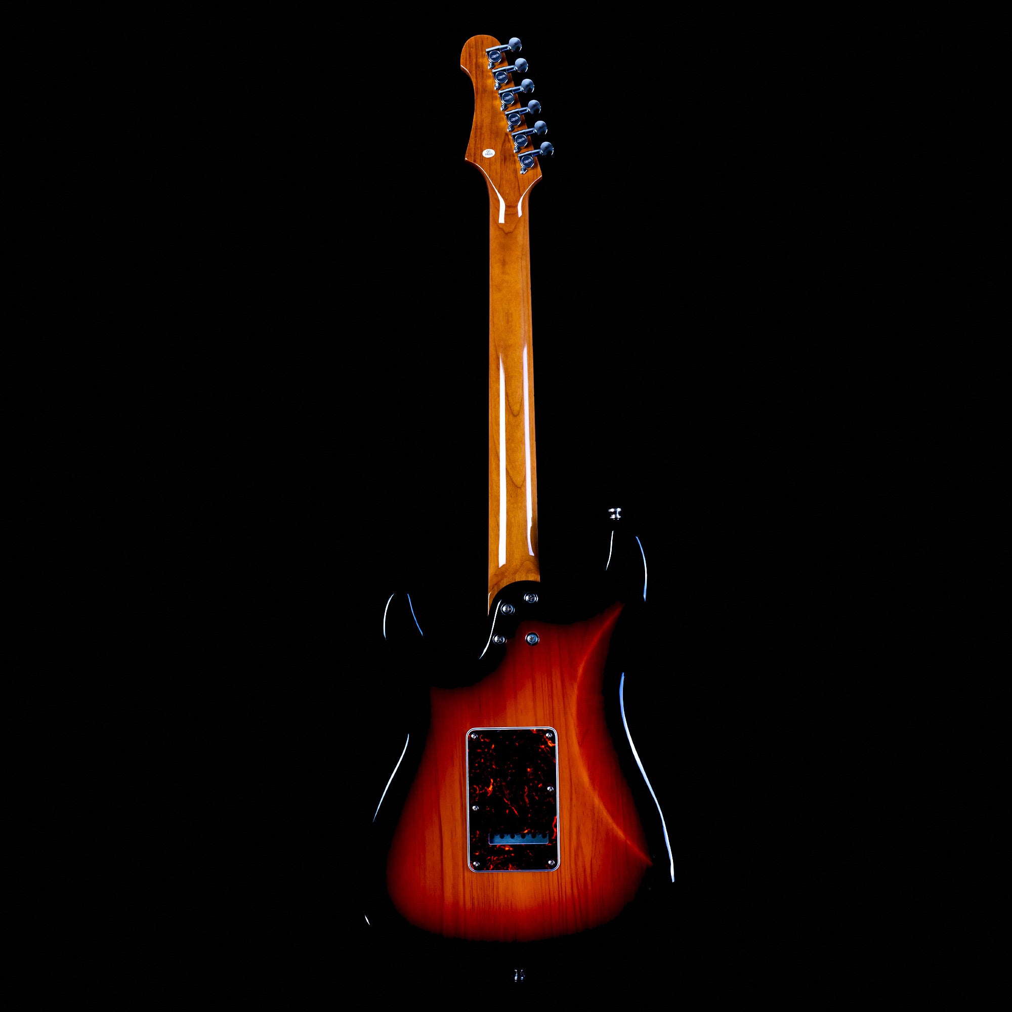 Sunburst electric guitar shown from the back, highlighting a glossy wooden neck and the rear electronics panel on a dark background.