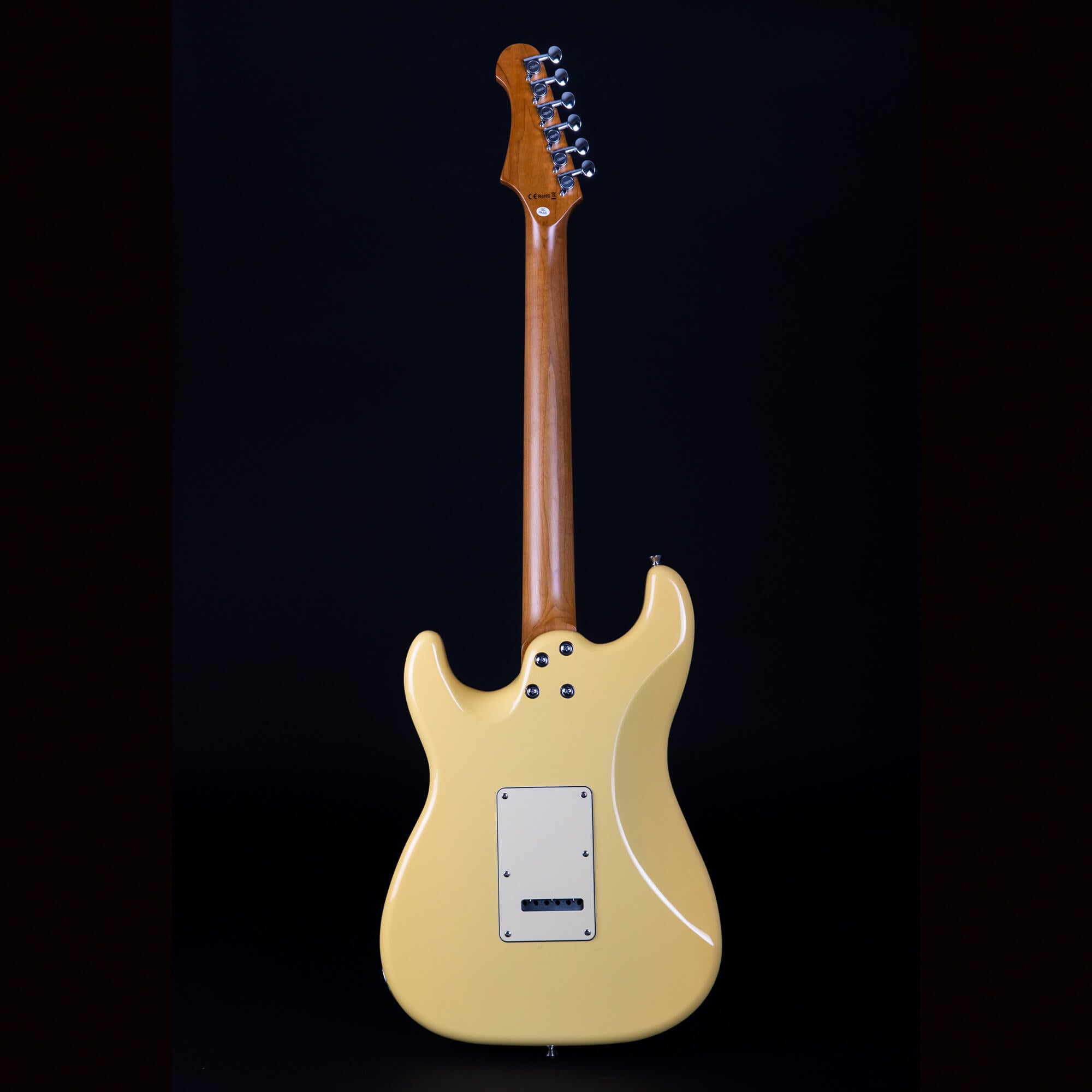 Yellow electric guitar shown from the back, exposing the wooden neck, tuning pegs, and a cream-colored rectangular electronics cover plate.