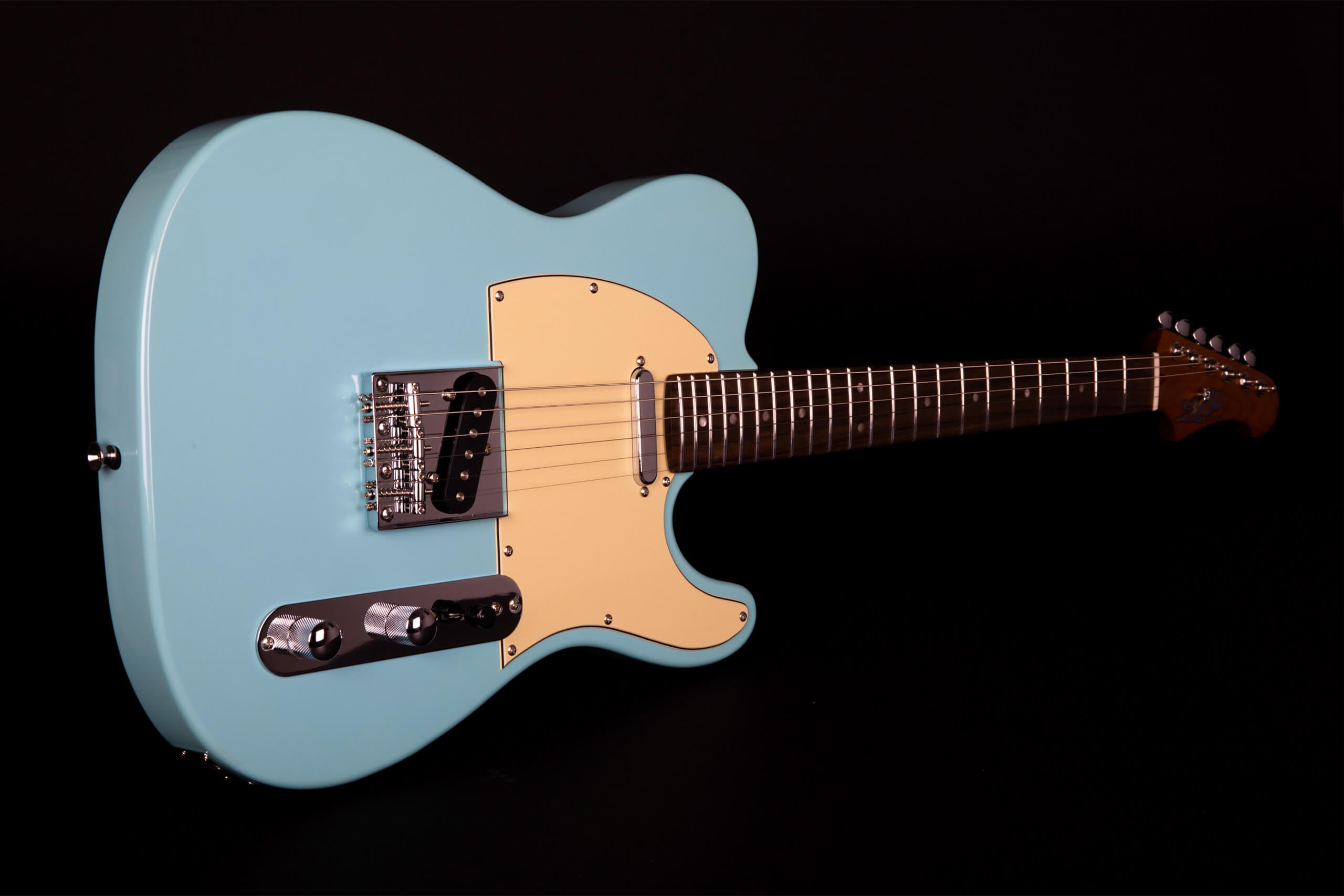 Light blue electric guitar with a cream pickguard, chrome hardware, dark wood fretboard, and six tuning pegs on the headstock.