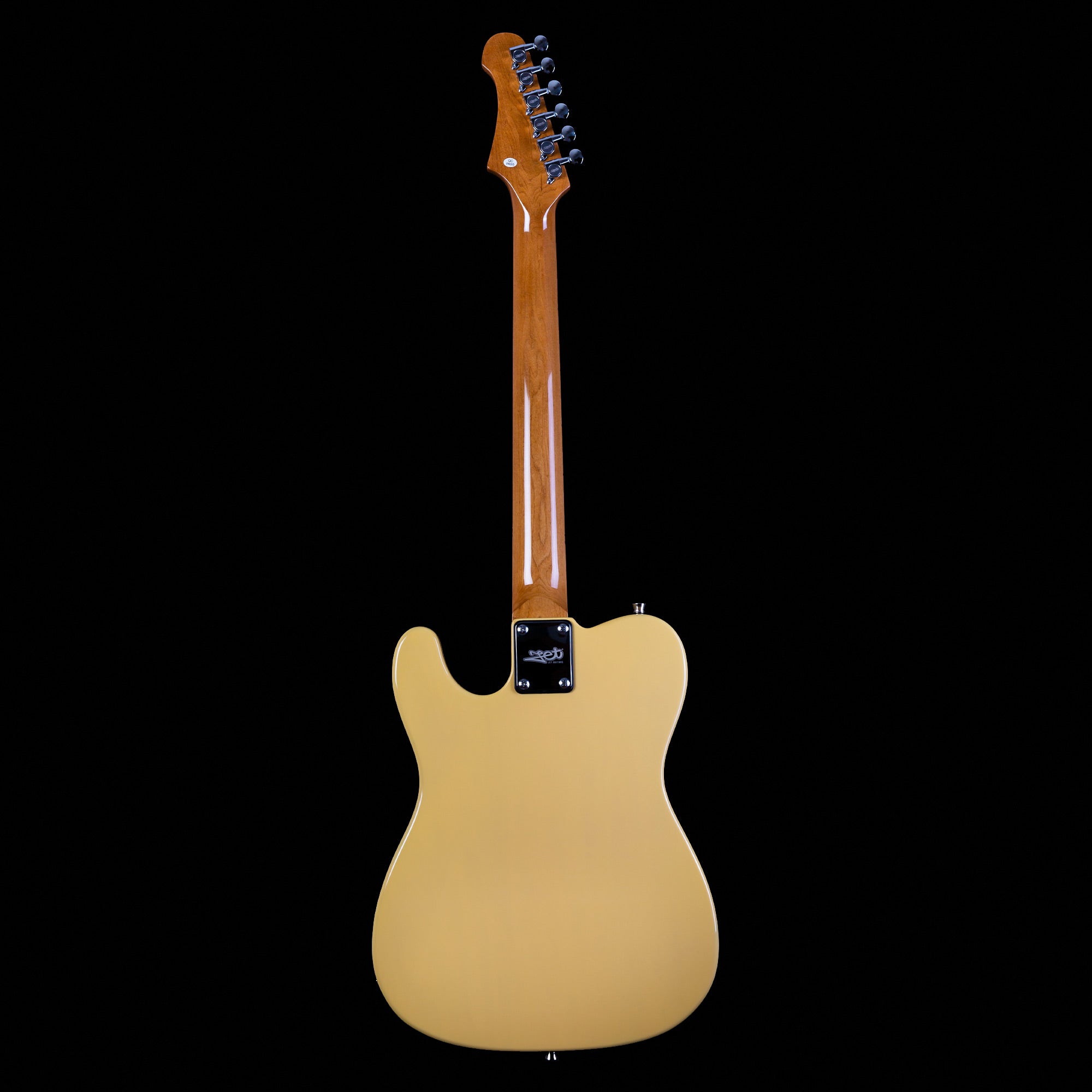 Yellow electric guitar shown from the back, featuring a glossy light wood neck and six tuning pegs, set against a black background.