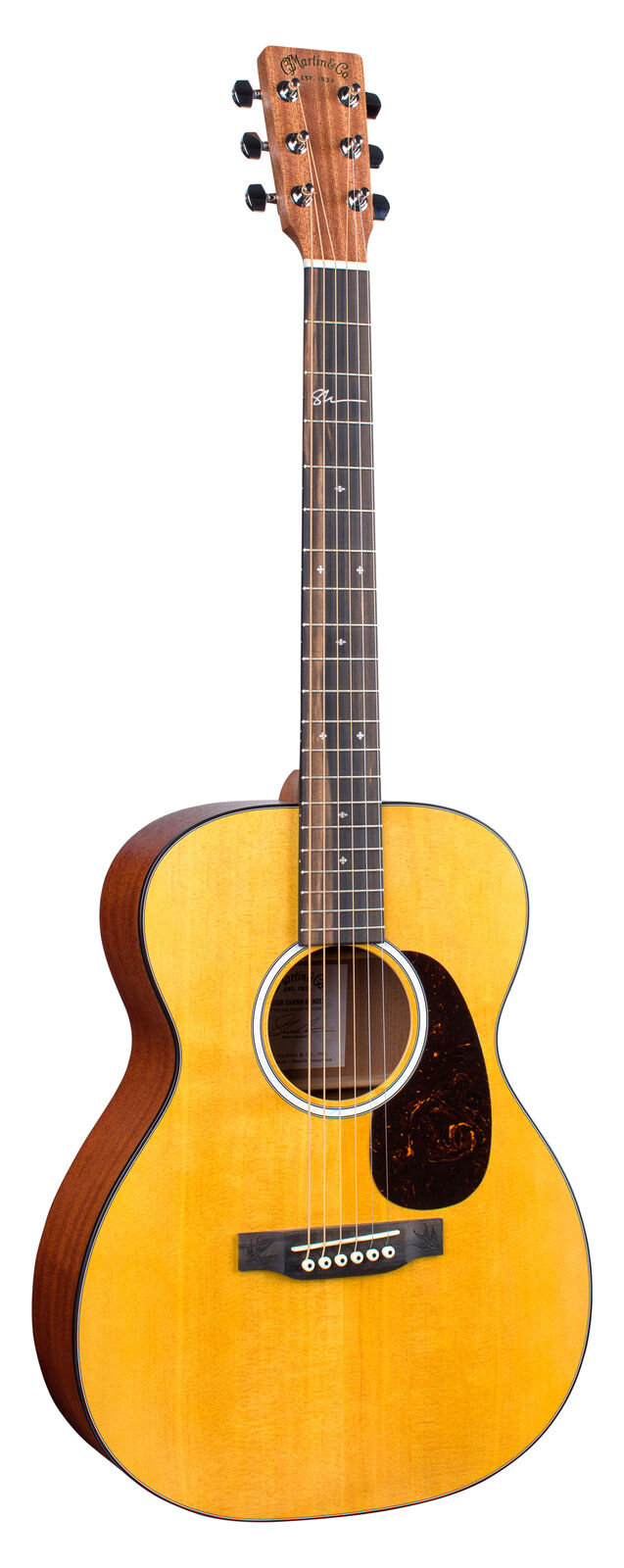 Acoustic guitar with a natural wood top, dark sides and back, six strings, and a black pickguard beside the sound hole.