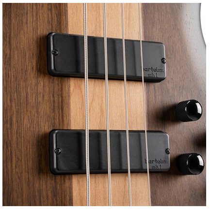 Four metal strings cross over two rectangular black pickups and two control knobs on a brown wood electric bass body.