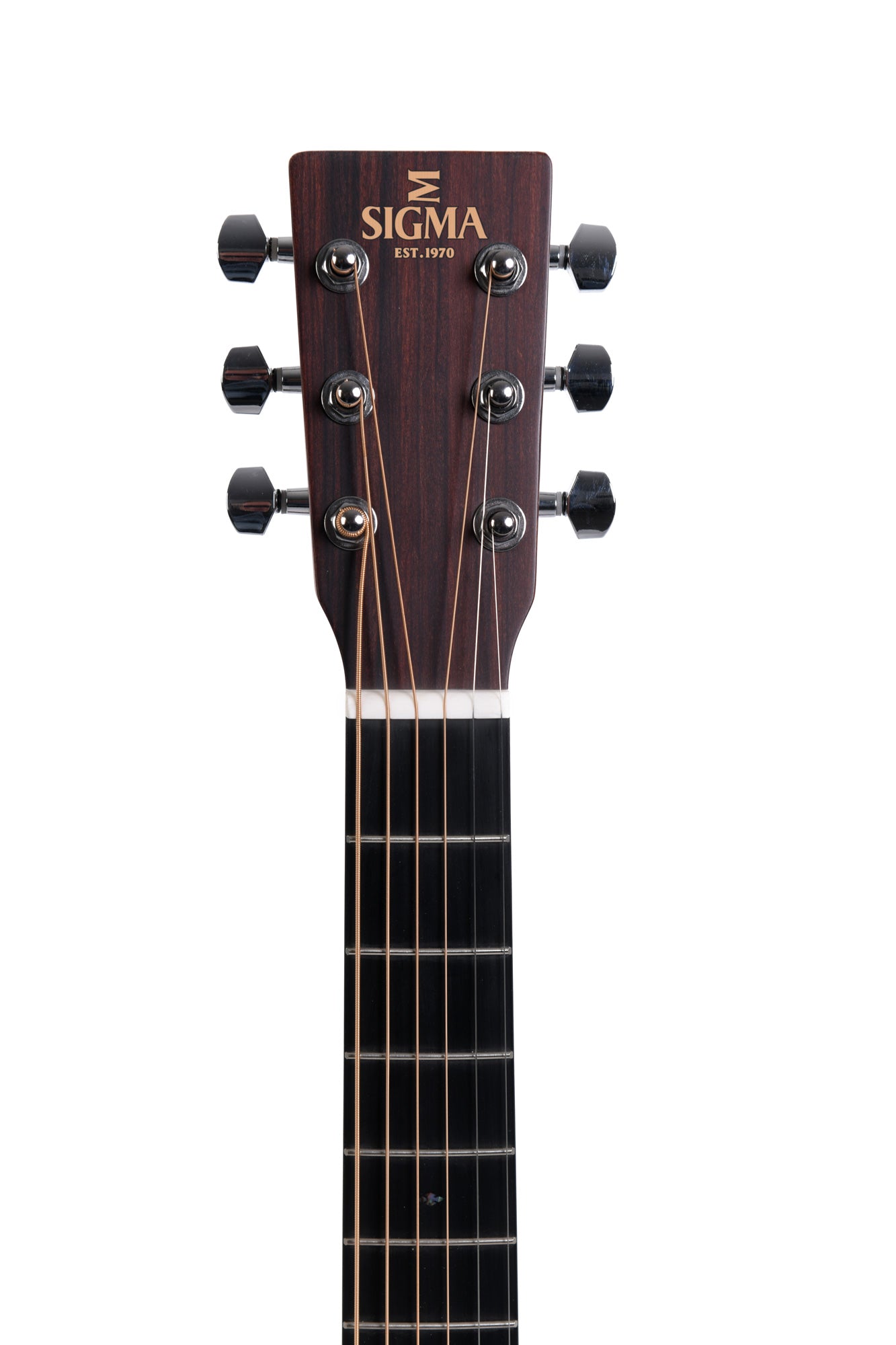 Headstock of a Sigma acoustic guitar with six tuning pegs, dark wood finish, and “Sigma Est. 1970” logo in gold lettering.