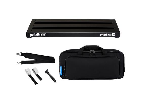 Rectangular black pedalboard with "pedaltrain metro 20" label, padded carrying case, shoulder strap, Velcro strips, and cable ties. Accessories set.