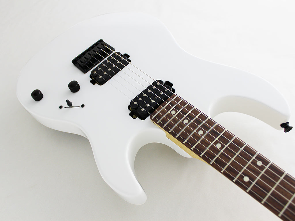 White electric guitar with black pickups, two black knobs, a switch, and a rosewood fretboard with dot inlays.