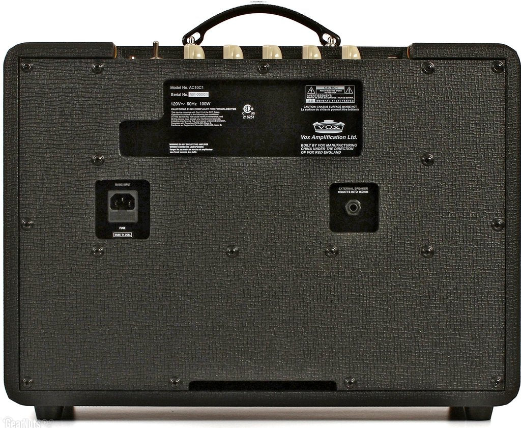 Back side of a Vox amplifier featuring a power input, external speaker jack, control panel knobs on top, and textured black casing with labels.
