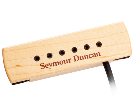 Rectangular light wood guitar pickup with six black pole pieces, 