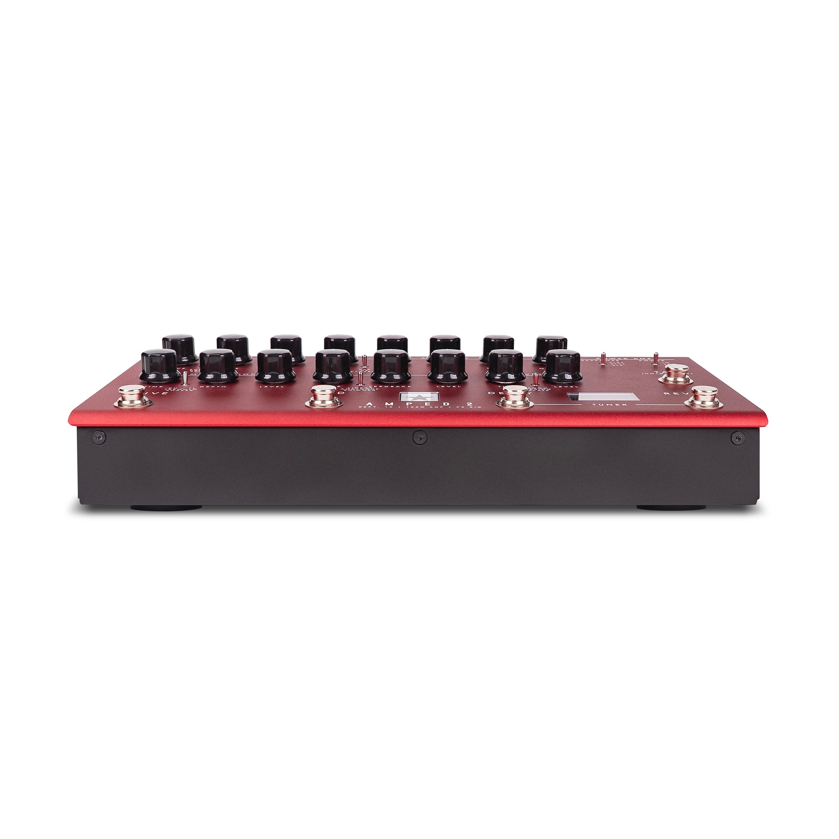 Red and black amplifier with multiple black control knobs and silver footswitches on the top panel, viewed from the front edge at a low angle.
