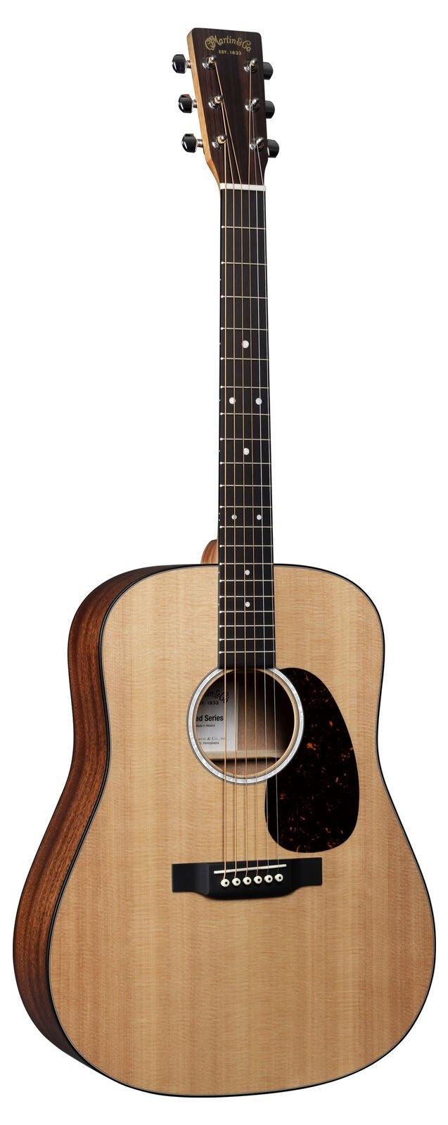 Acoustic guitar with a natural wood finish, dark sides, six steel strings, black pickguard, and dot inlays on the fretboard.