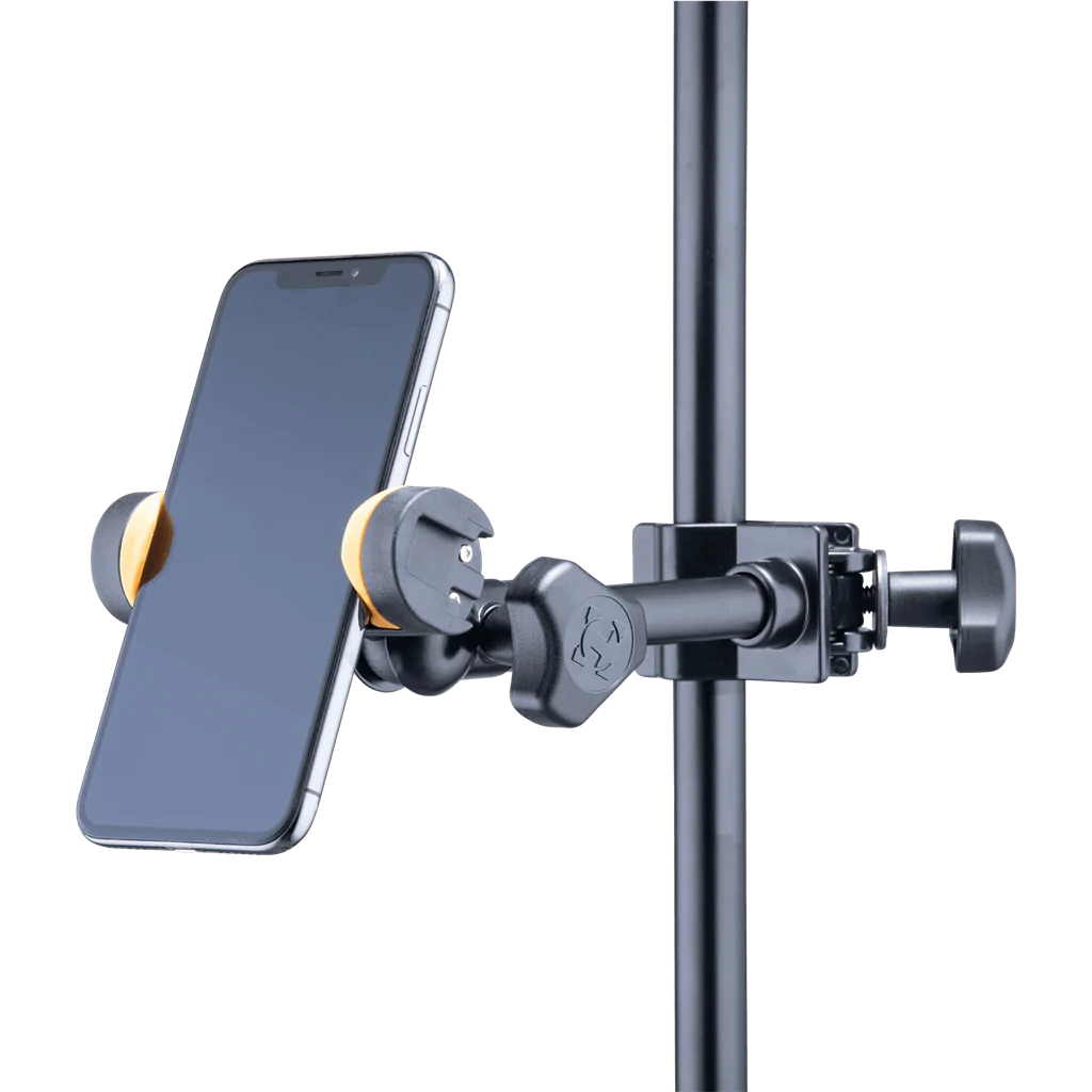 iPhone mounted in a black adjustable clamp holder attached to a vertical metal pole, with yellow grip accents on the holder.