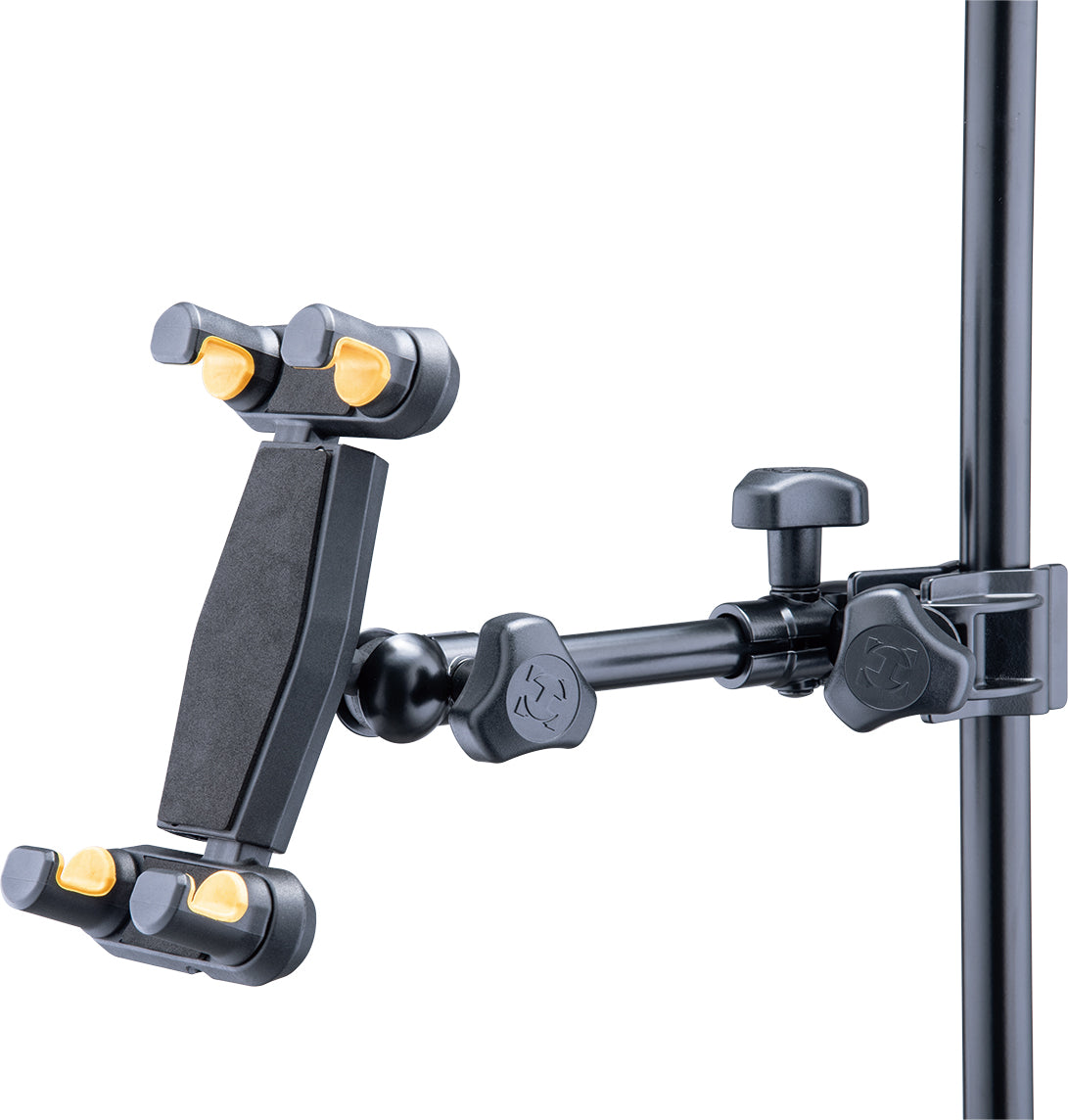 Adjustable black mount for iPhone and tablet, featuring yellow grips and clamp, attached to a vertical metal pole with locking knobs.
