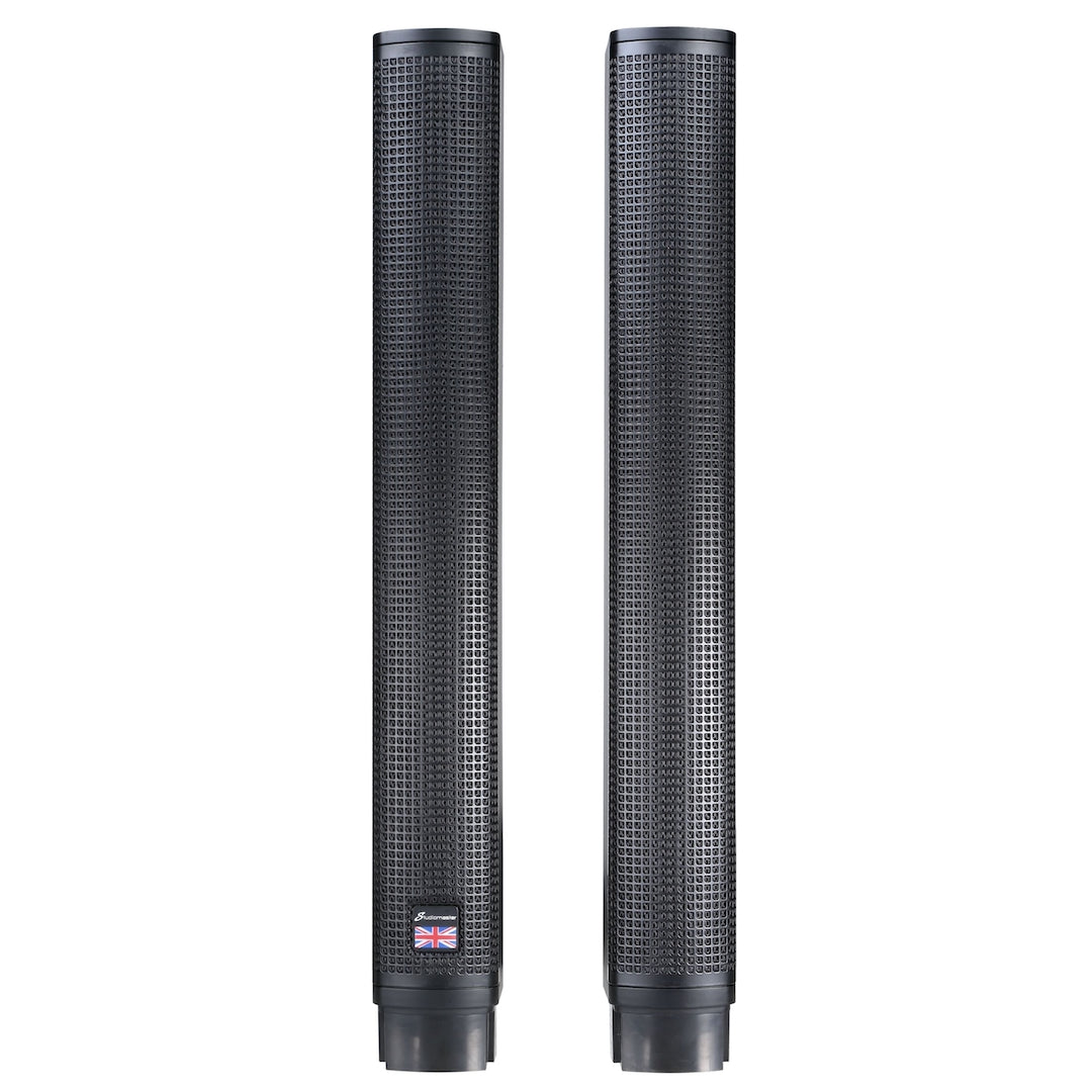 Two tall, slim black PA speakers with a perforated metal grille front and a small UK flag label at the bottom of the left unit.