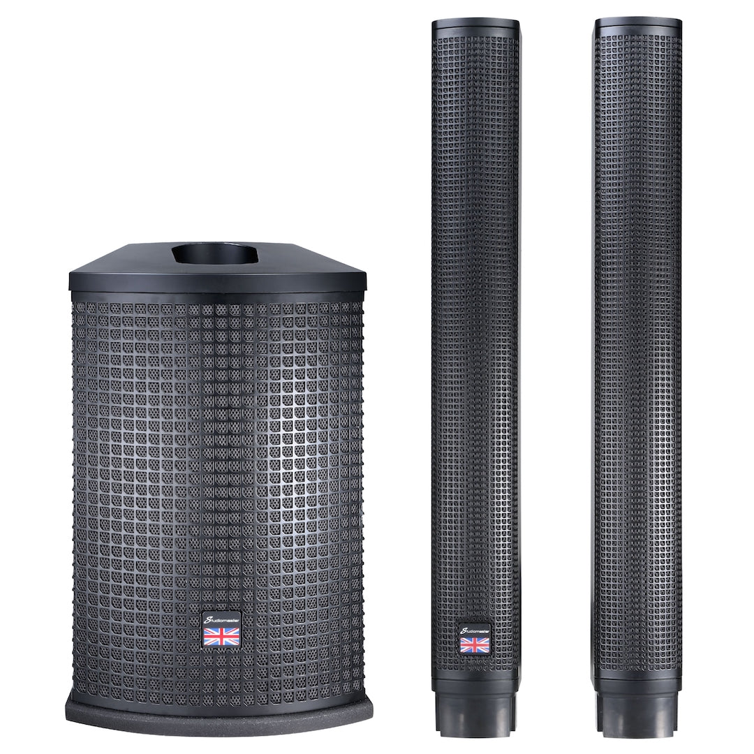 Three-piece black PA equipment set with one large cube-shaped speaker and two tall, slim column speakers, each with a small UK flag badge.