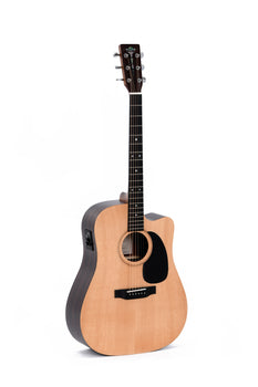 Acoustic guitar with a natural wood top, black pickguard, cutaway body, and six tuning pegs. A control panel is visible on the side.