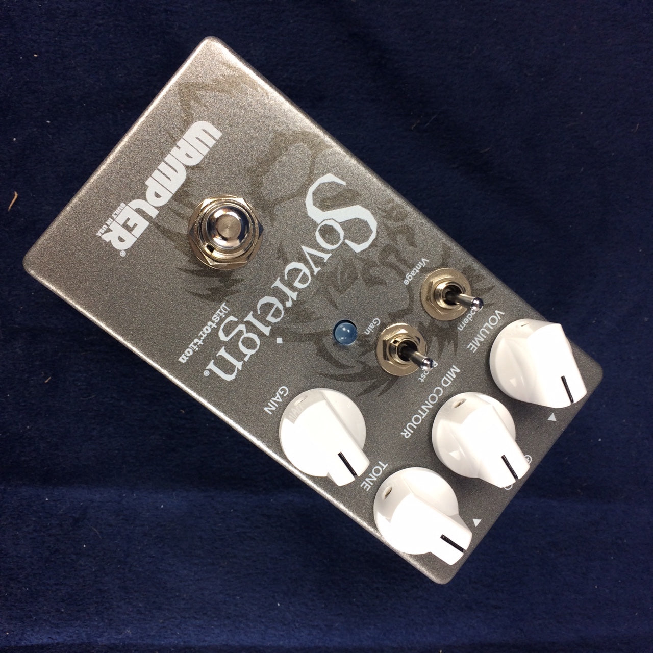 Wampler Sovereign distortion effects pedal with four white knobs, two toggle switches, a silver footswitch, and gray metallic casing.