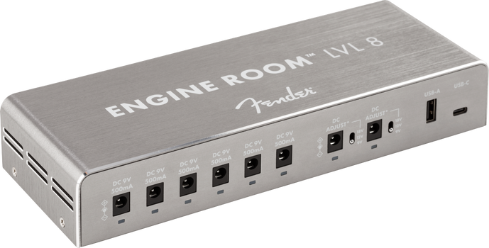 Rectangular metal FX pedal power supply with eight DC outputs, two adjustable voltage ports, and USB-A and USB-C charging ports on the front panel.