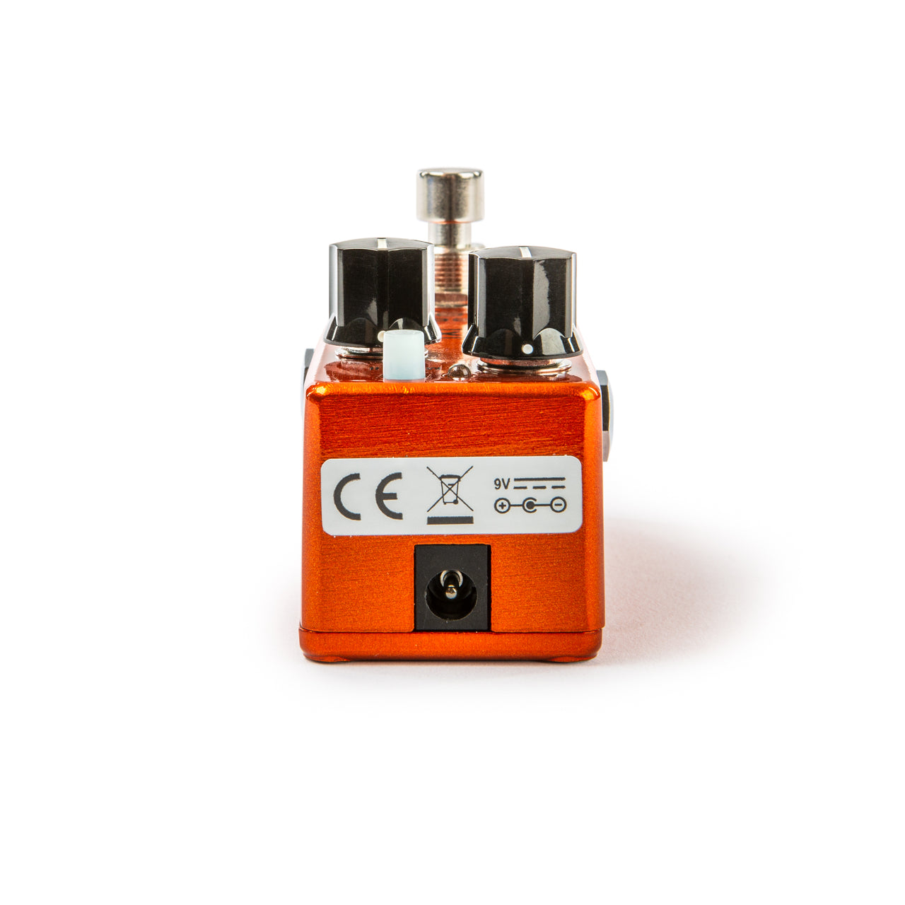 Compact orange FX pedal with two black knobs, a metal footswitch, a 9V power input, and certification symbols on the back panel.