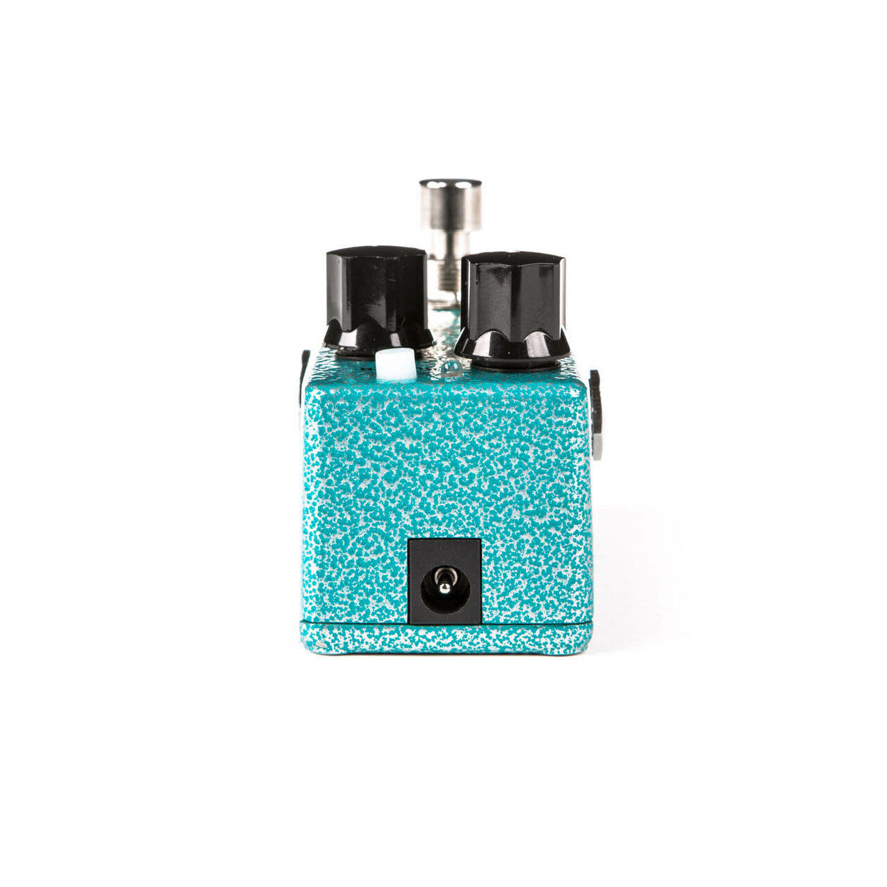 Turquoise speckled effects pedal with two large black knobs, a white switch, and a power input jack on the front panel.