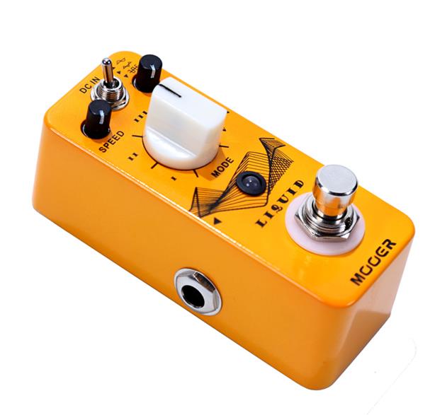 Orange effects pedal with black and white knobs, a toggle switch, a footswitch, and labeled “LIQUID” and “MUGER” on the top surface.