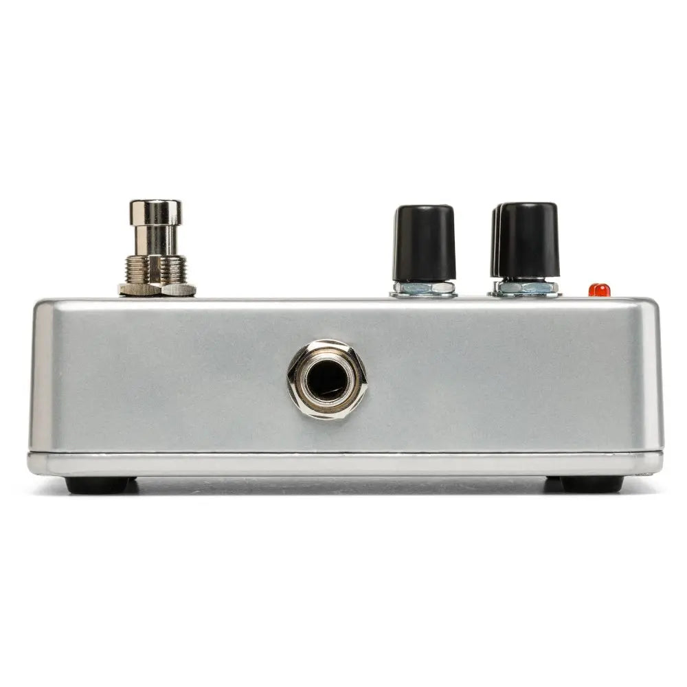 Silver effects pedal with a footswitch, two black control knobs, a jack input, and a small orange indicator light on top.