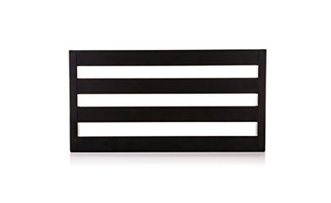 Rectangular black accessory with four horizontal slats and open gaps in between, likely used for organizing or displaying items.