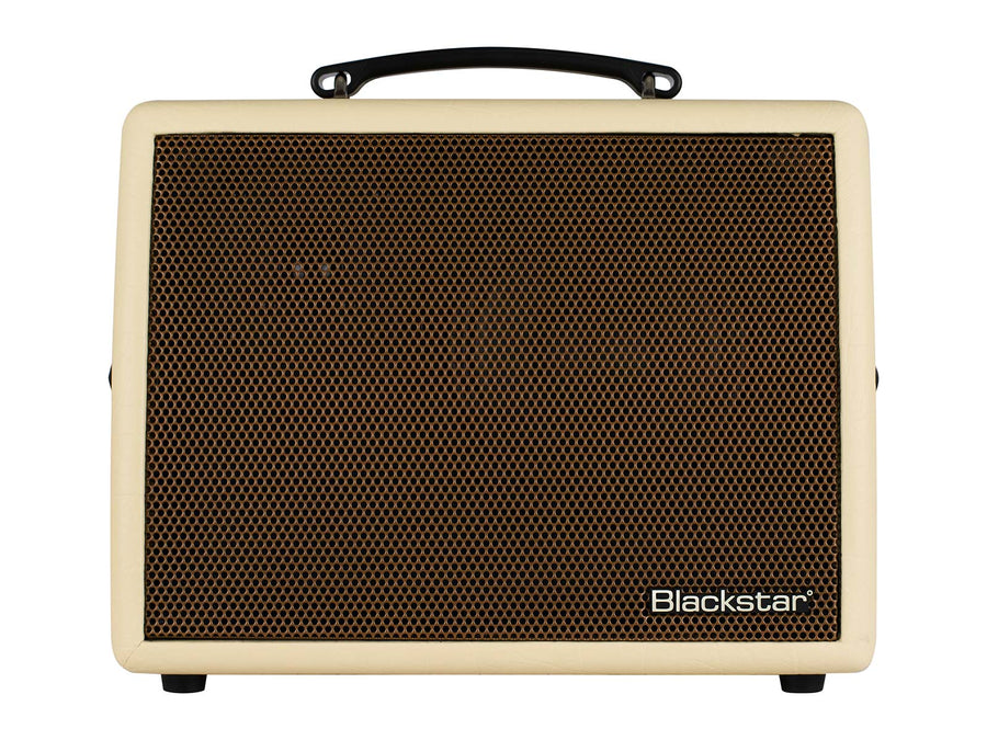 Cream-colored Blackstar amplifier with a large brown speaker grille, black handle on top, and small Blackstar logo at the bottom right corner.