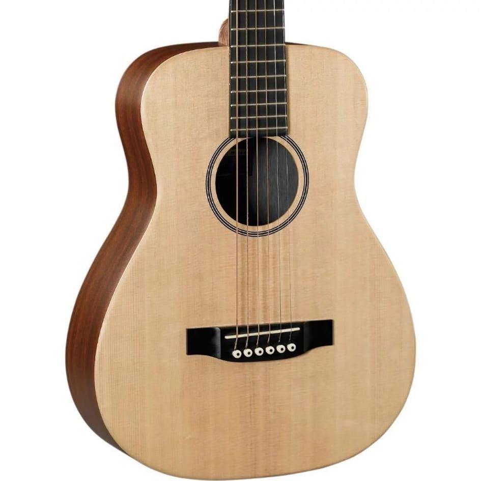 Light wood acoustic guitar with a rounded body, dark bridge, six strings, and a simple black-bordered sound hole.